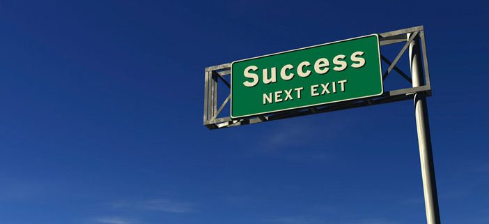 Highway sign saying Success Next Exit