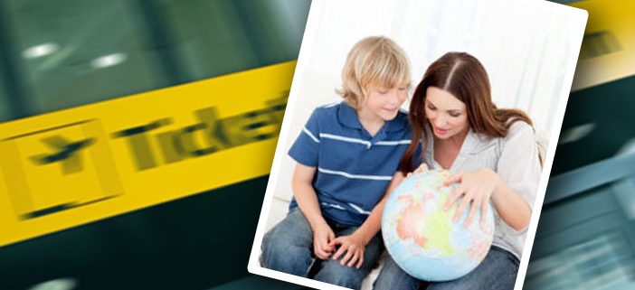 woman looking at globe with boy