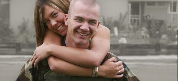 Young military couple hugging and smiling
