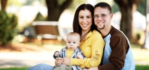 Young couple with baby on lap