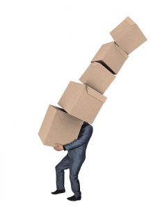 man carrying lots of moving boxes